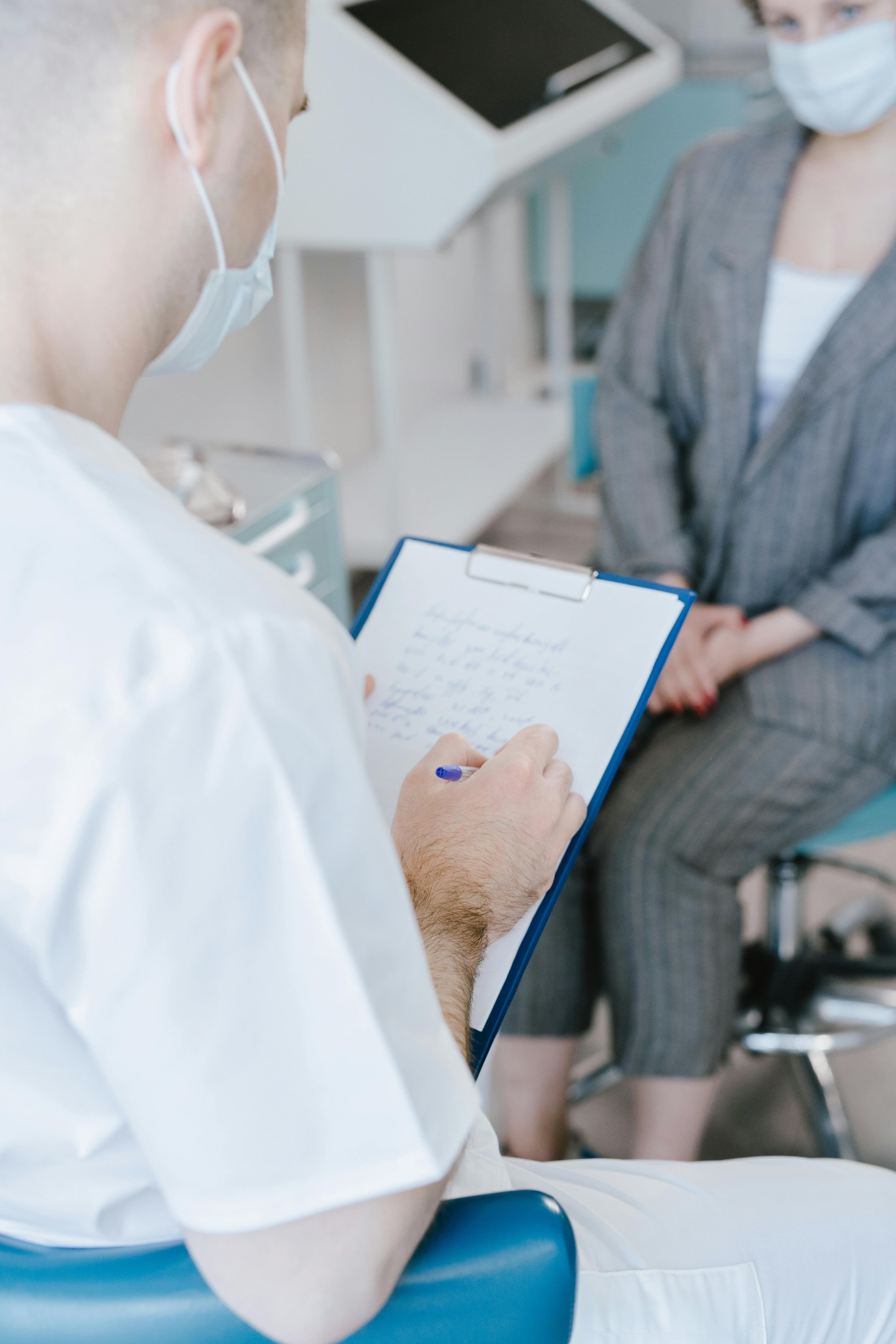 Doctor examining patient with stethoscope