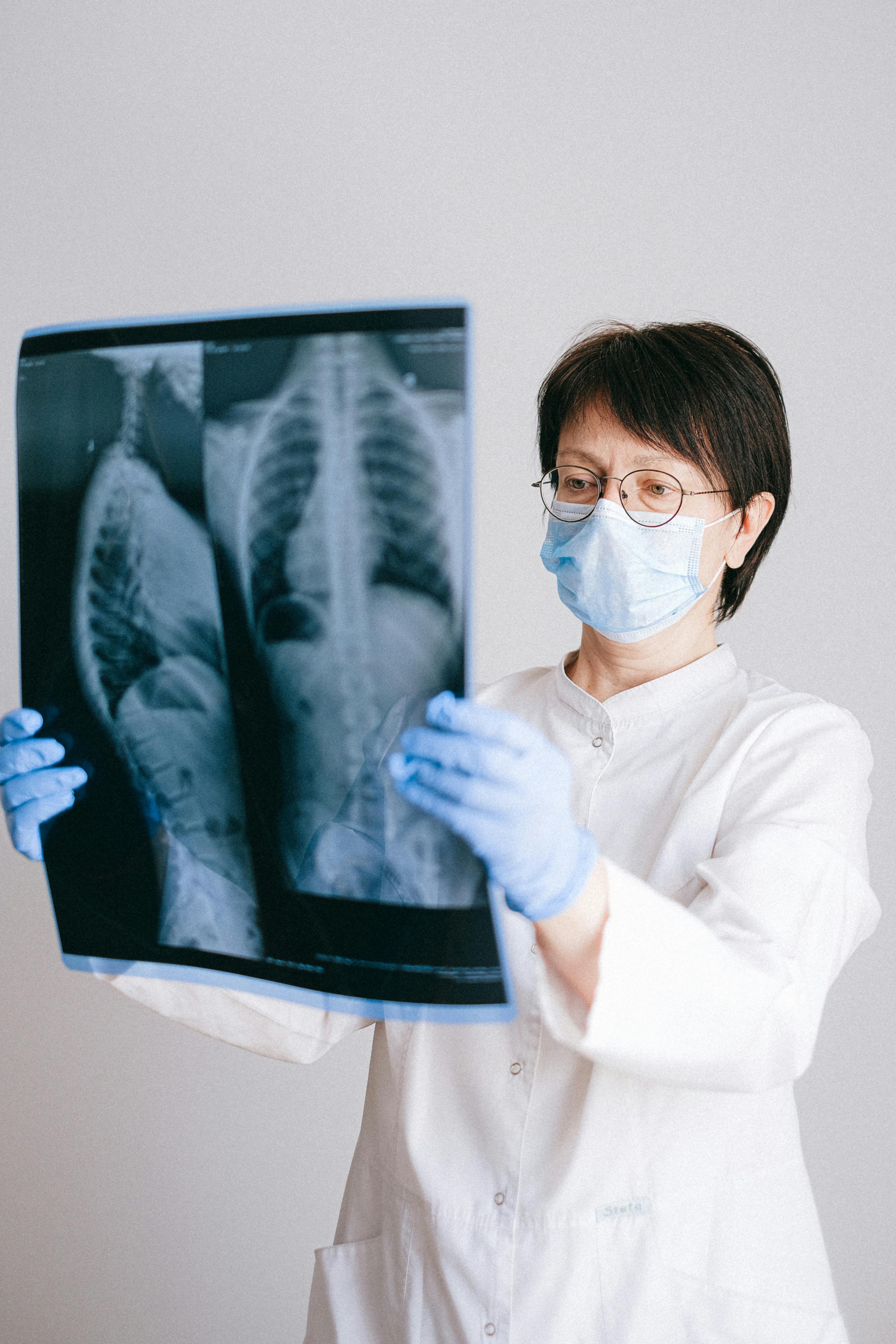 Doctor treating patient with back pain
